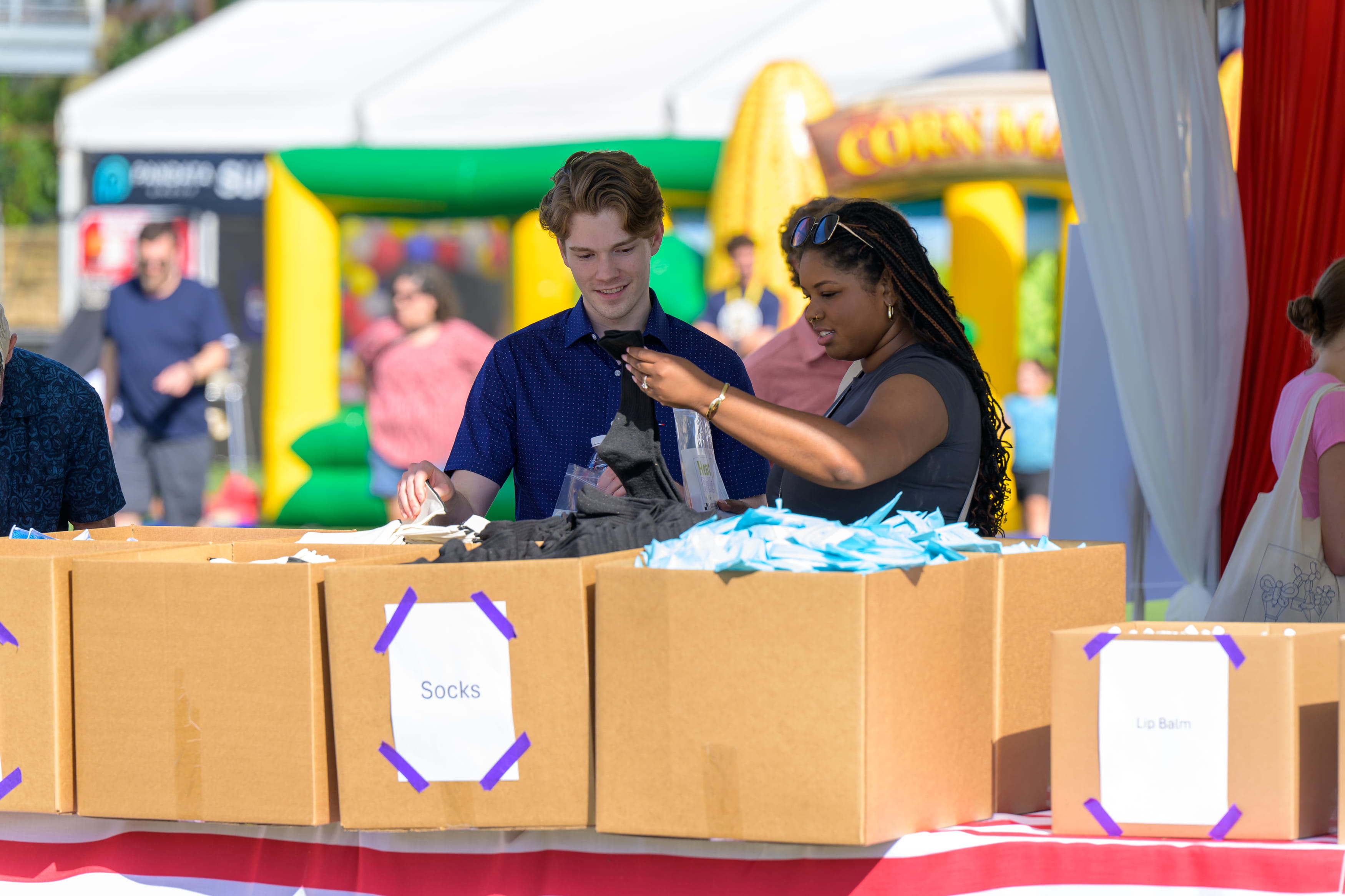 Give Back Bash attendees prepare packages for local nonprofits